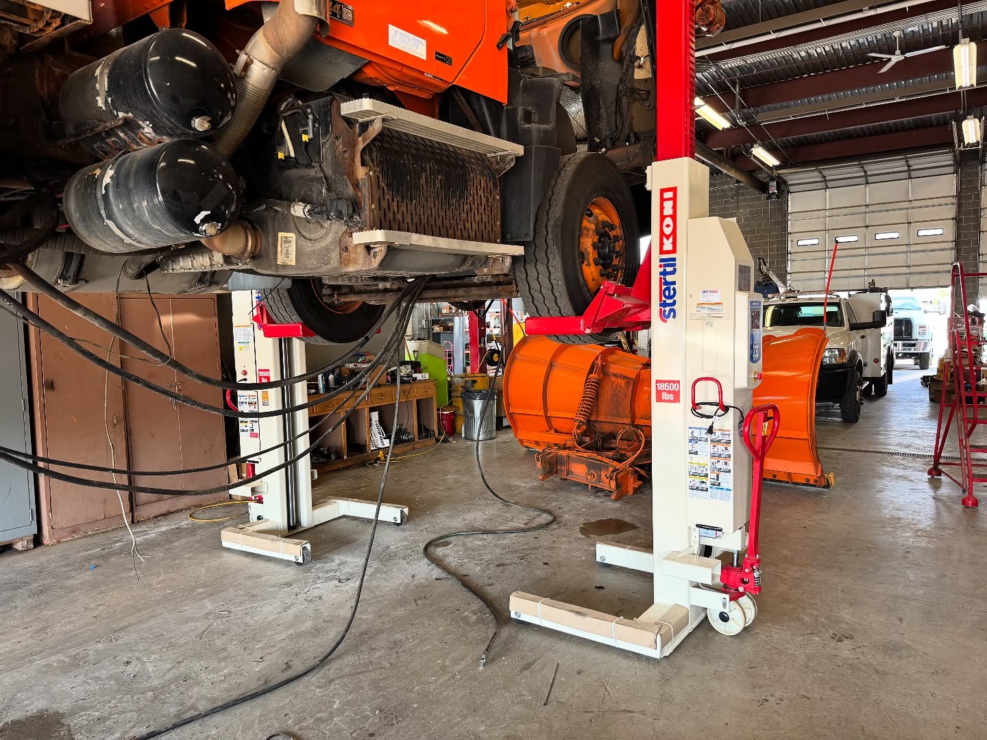 Commercial truck supported by Stertil-Koni mobile column lifts