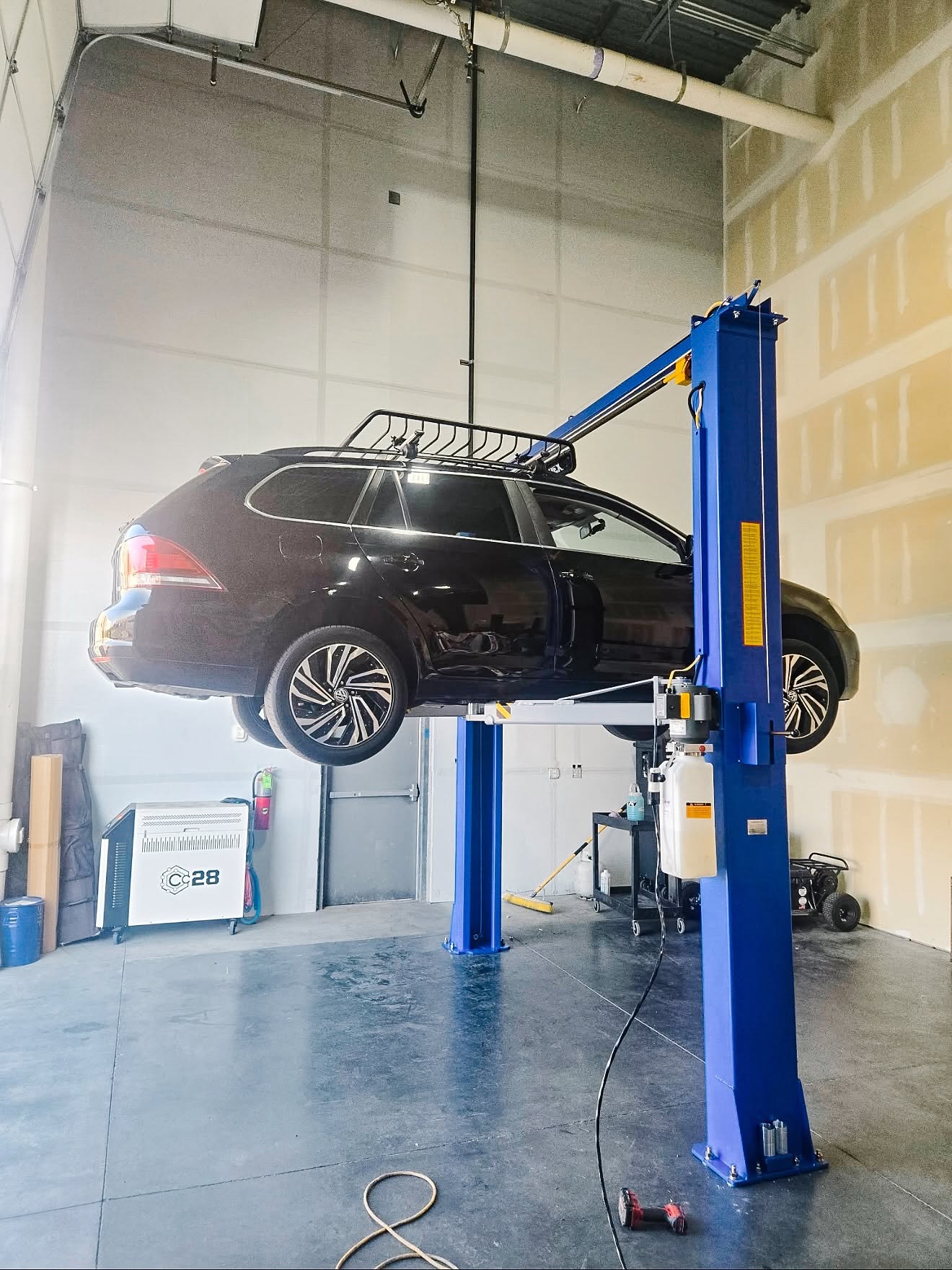 Passenger vehicle on a two-post lift