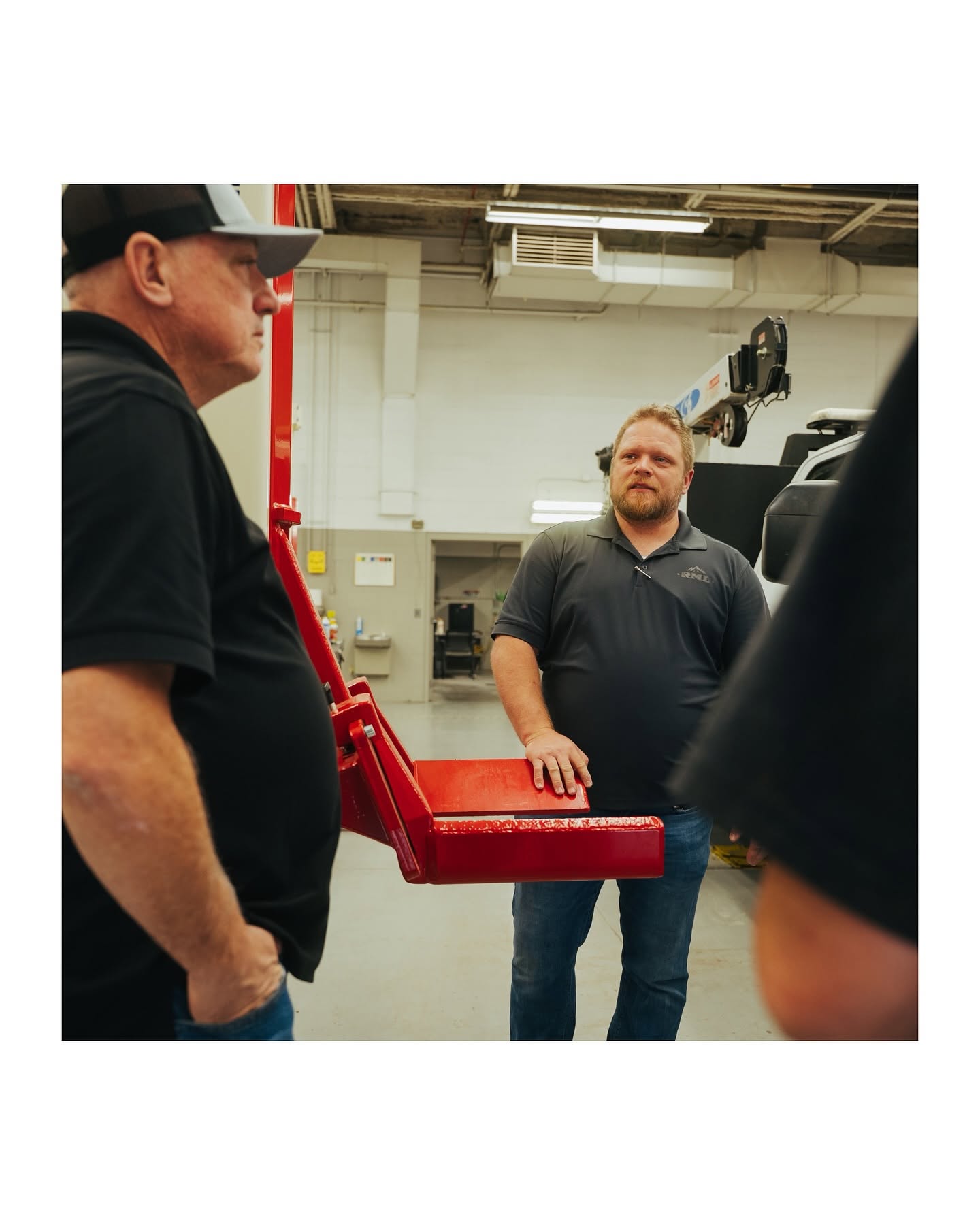 Rocky Mountain Lifts subject matter experts discussing heavy-duty lifting equipment with a customer